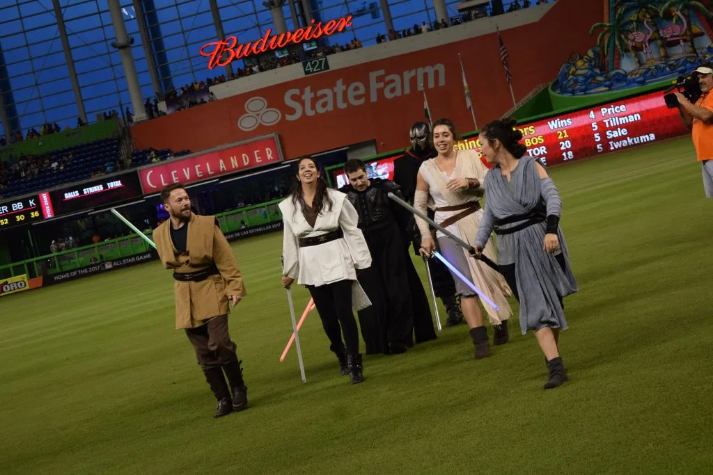 (Left to right) Instructor Alfred Smith and Senior Knights Ana Ma Jacome, Chad Benitez, Stephen Carter, Samantha Huddleston, and Sarah Cole exiting the field