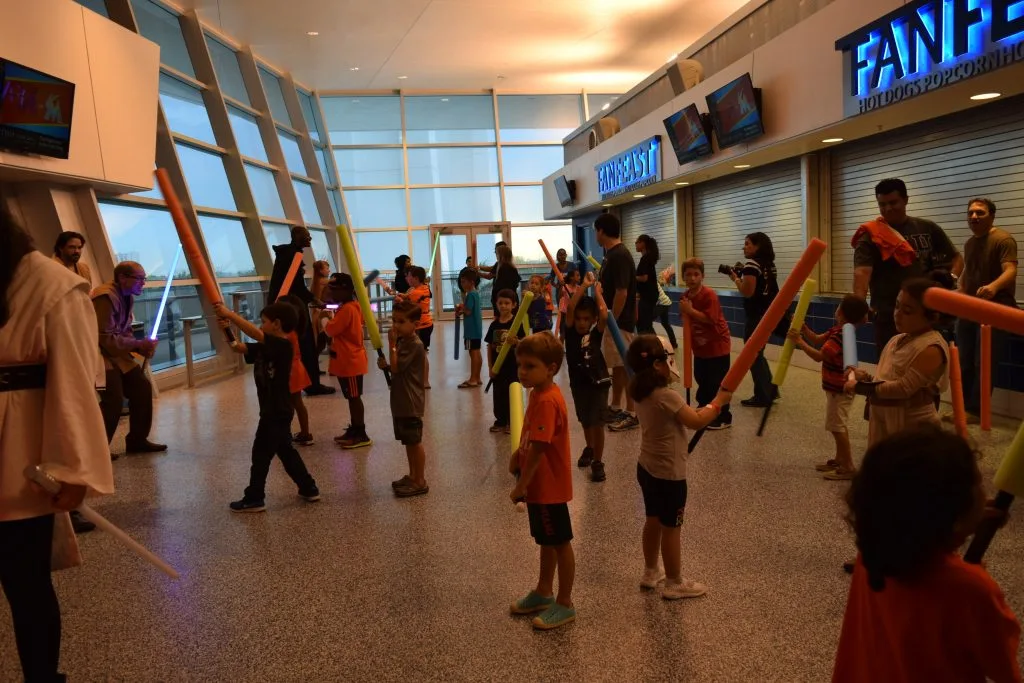 Magic City JEDI Senior Knights teach the basics of Lightsaber combat choreography at Marlin Stadium "Star Wars Night"